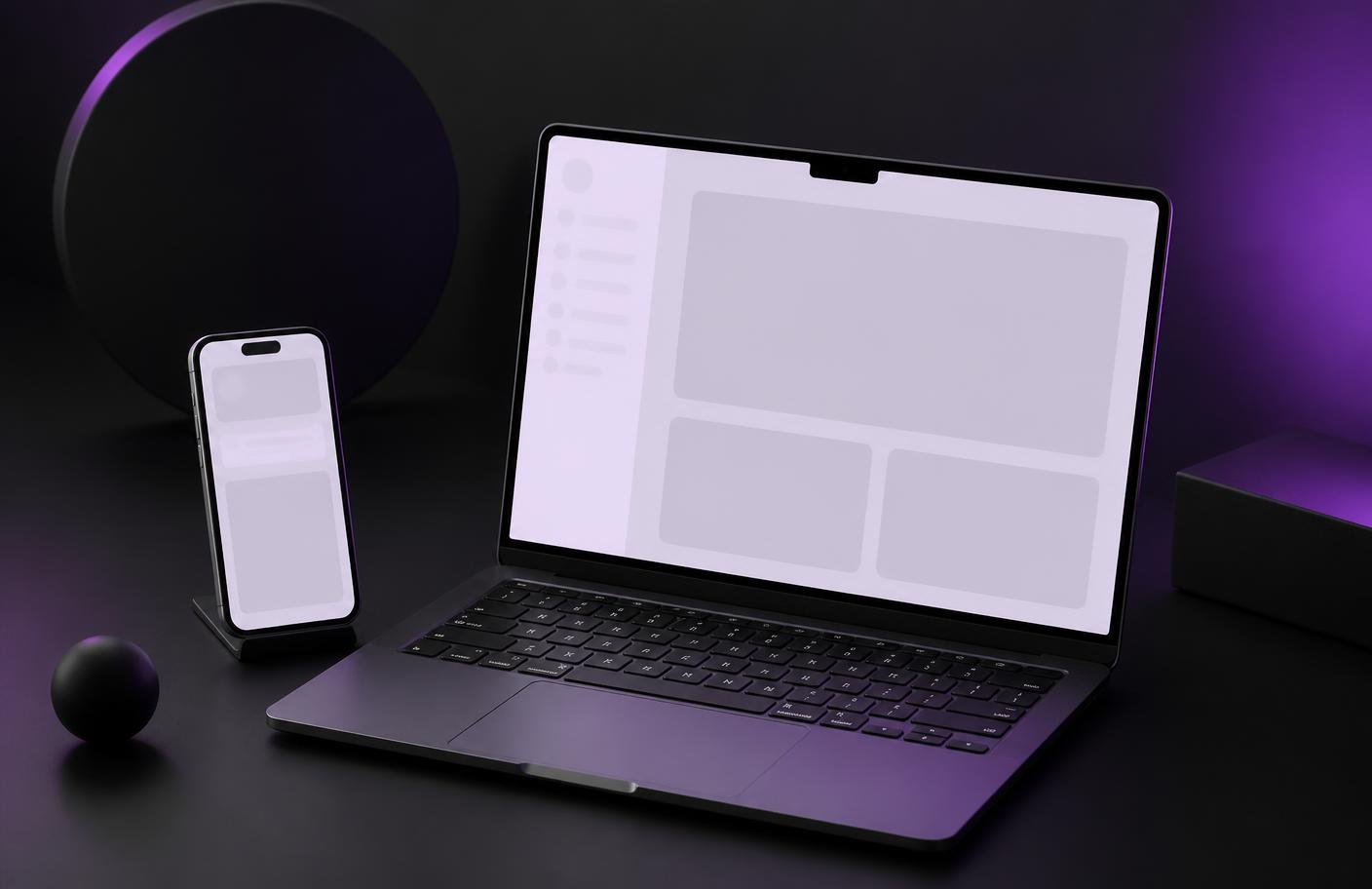 Laptop and phone displaying a responsive website layout designed by Amplifi Studio